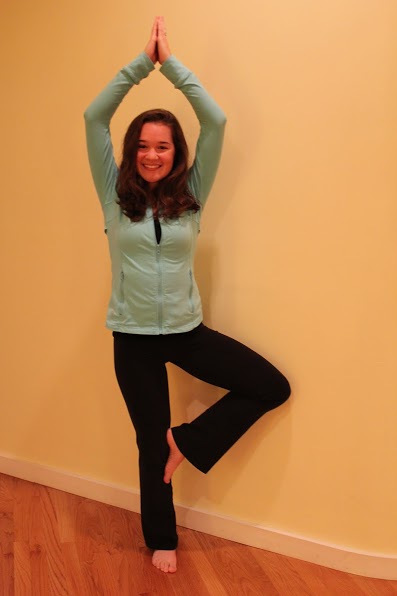 Senior Maddy Childs demonstrates the tree pose. Childs completed a 200-hour training to get her yoga instructor license, and now teaches  her own classes. 