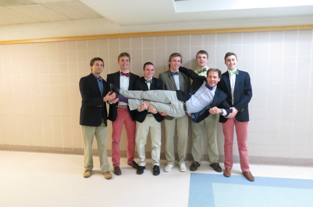Clad in bow ties, the boys of Beta House beam as they hold up their style mentor James Buckman. (Left to right: seniors Joe Egan, Colby Blaze, and Cam Curtin, junior Mike McDonough, senior Hayden Murphy, and sophomore Cooper Blaze).