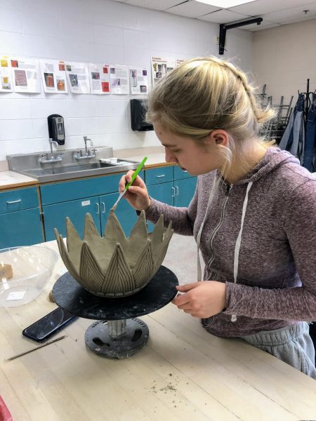Claire Hazard works on her ceramics project. 