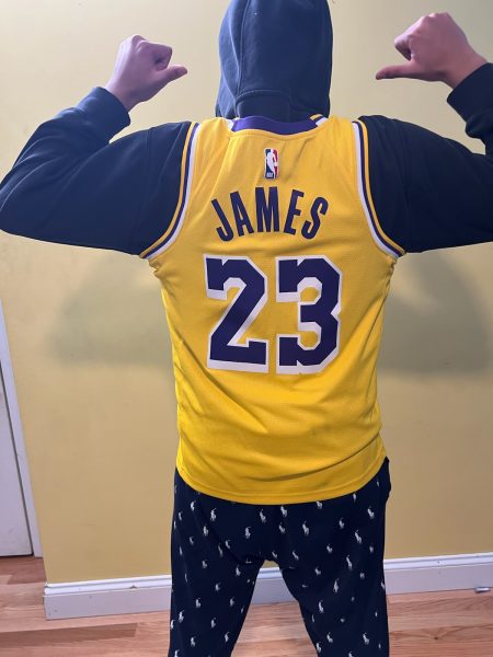 Muhammad showing off his Lakers jersey.
