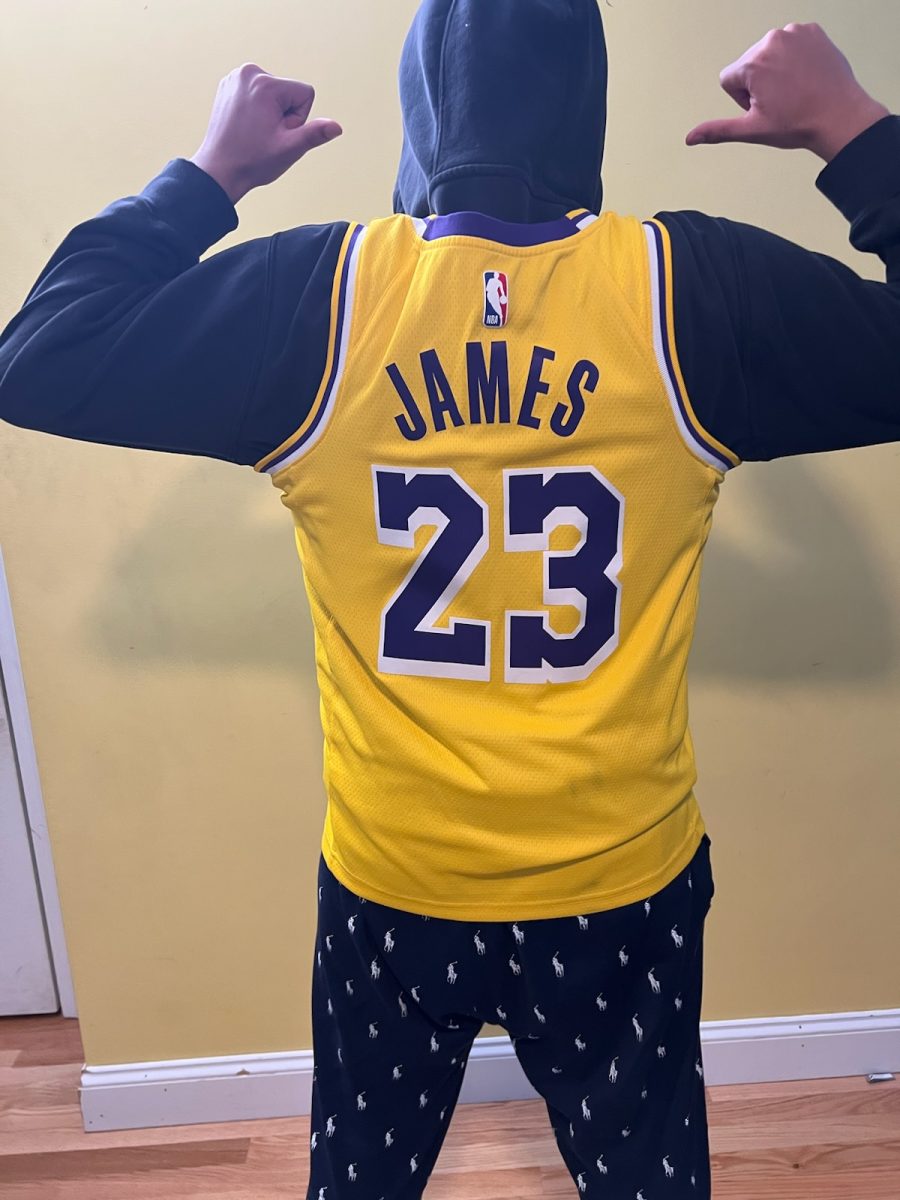 Muhammad+showing+off+his+Lakers+jersey.