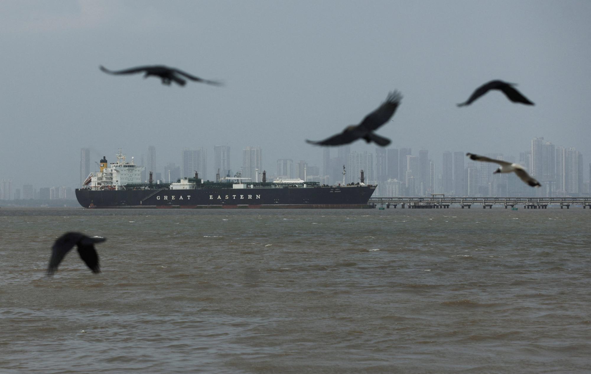 Birds fly near the Jag Vasant vessel transferring LPG at a port after transiting the Strait of Hormuz amid supply disruptions linked to the U.S-Israeli conflict with Iran, in Mumbai, India, April 1, 2026. REUTERS/Francis Mascarenhas