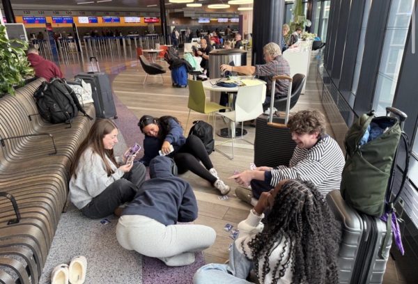 Students at the airport awaiting their flight