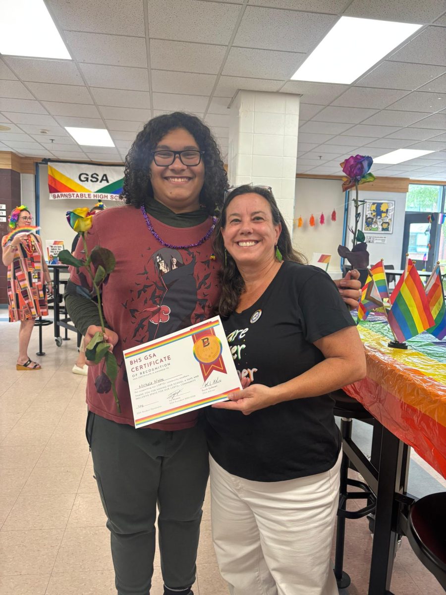  Ivy Nicacio with English teacher Michele Netto during GSA's Pride party. GSA members recognized teachers who are inclusive of LGBTQ+ students at there annual Pride party last Thursday.